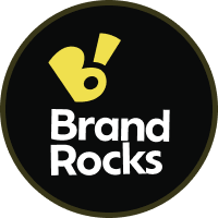 Avatar Agencji Reklamowej BrandRocks. Żółto białe logo na czarnym tle.